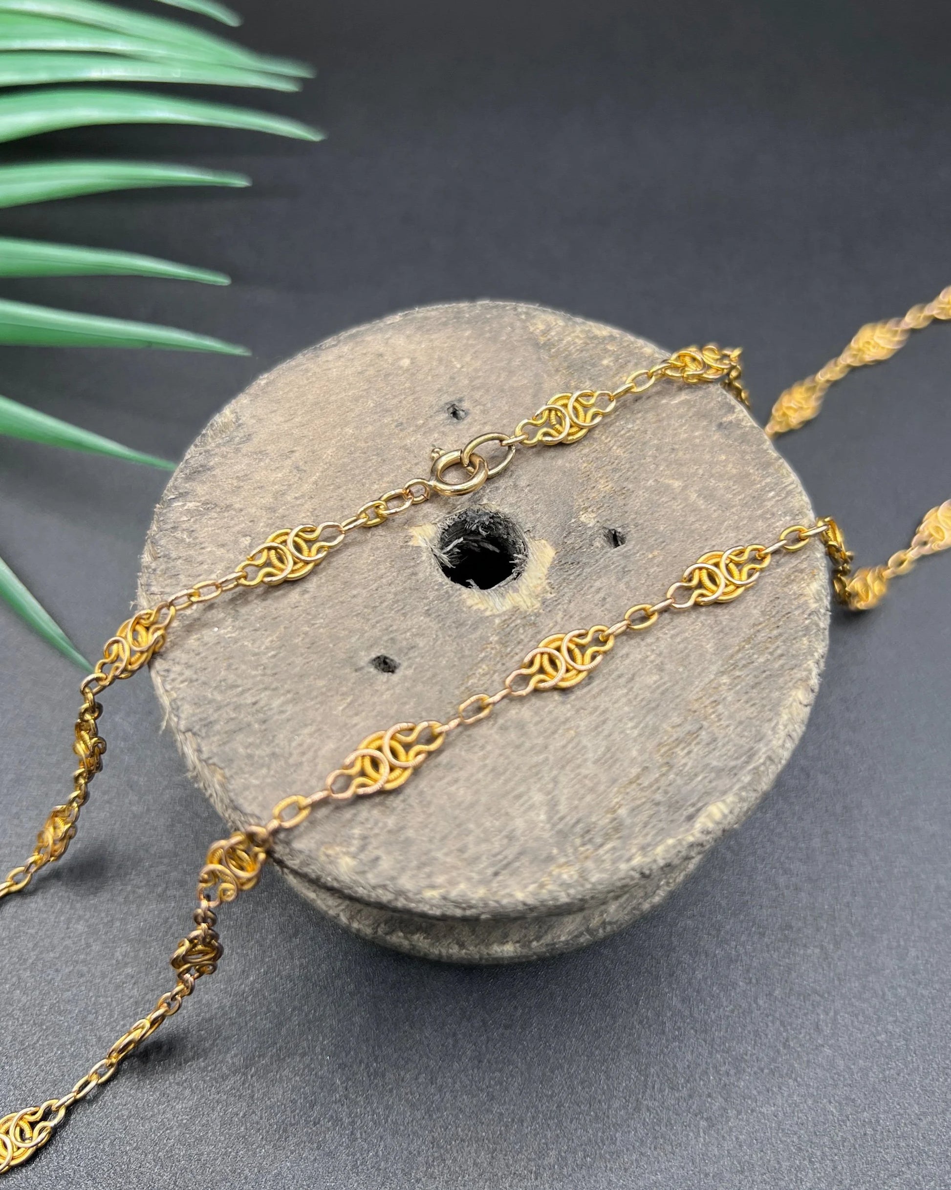 A yellow gold fancy link chain necklace