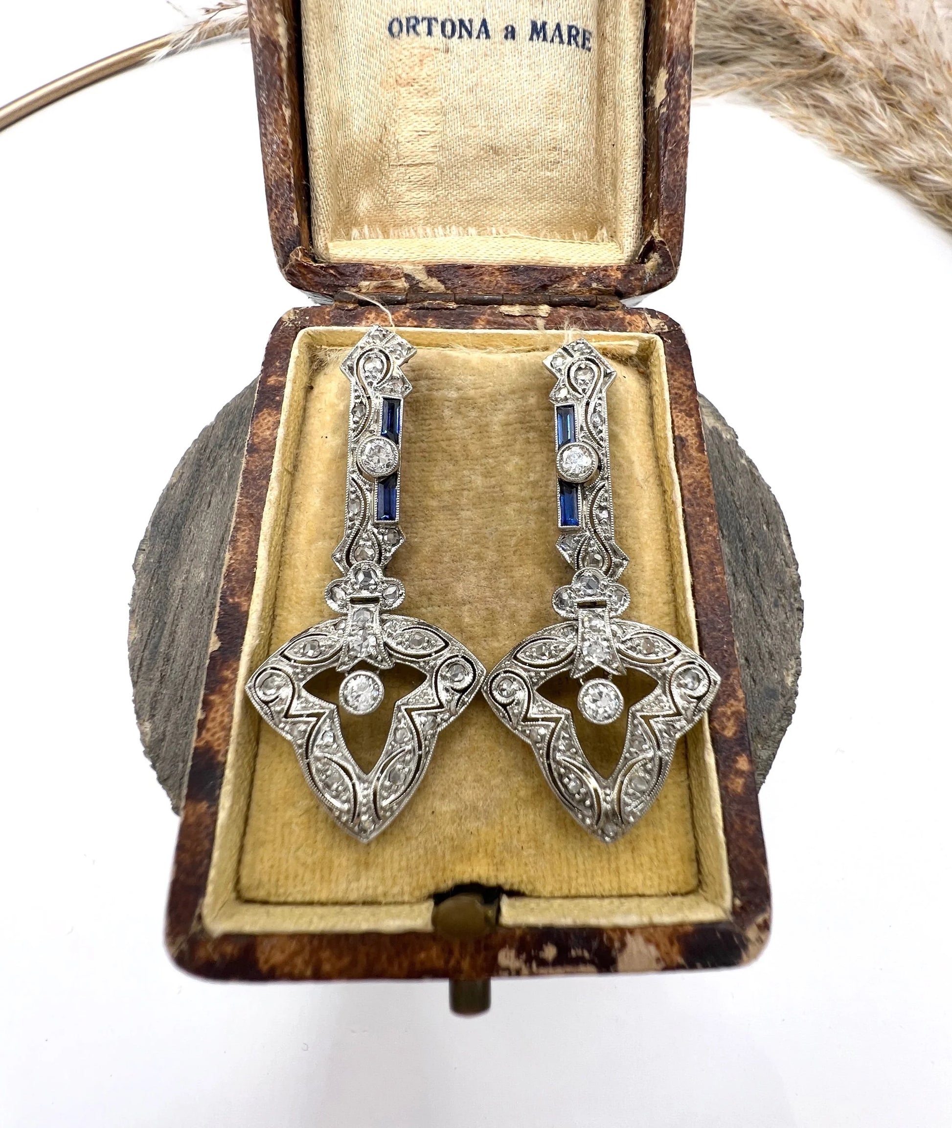 A pair of diamond and sapphire drop earrings, in an antique box