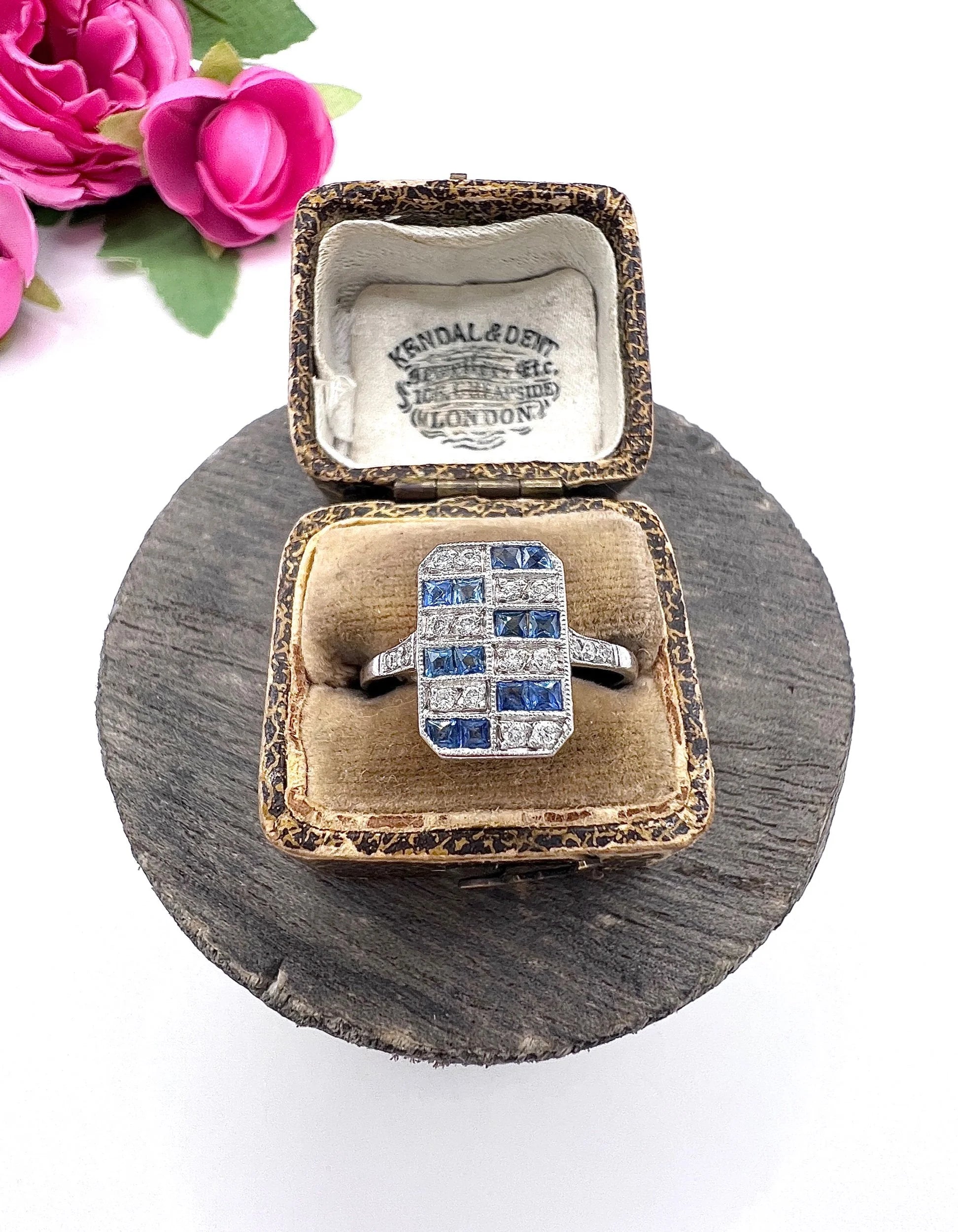 A sapphire and diamond tablet style ring in platinum, in an antique ring box