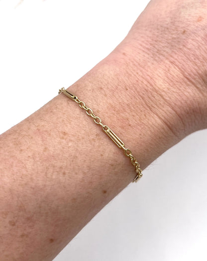 A yellow gold link bracelet, modelled on a wrist