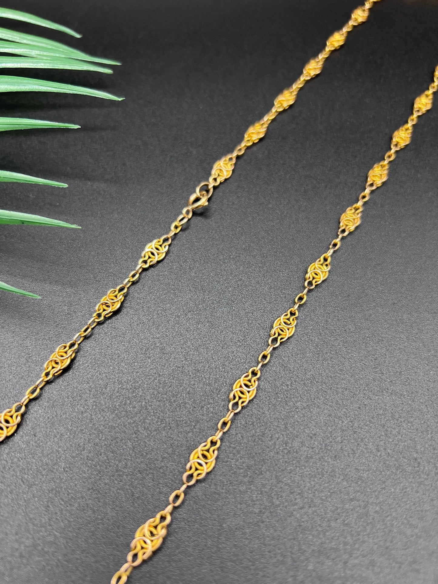 A yellow gold fancy link chain necklace