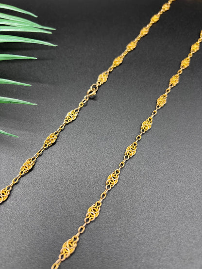 A yellow gold fancy link chain necklace
