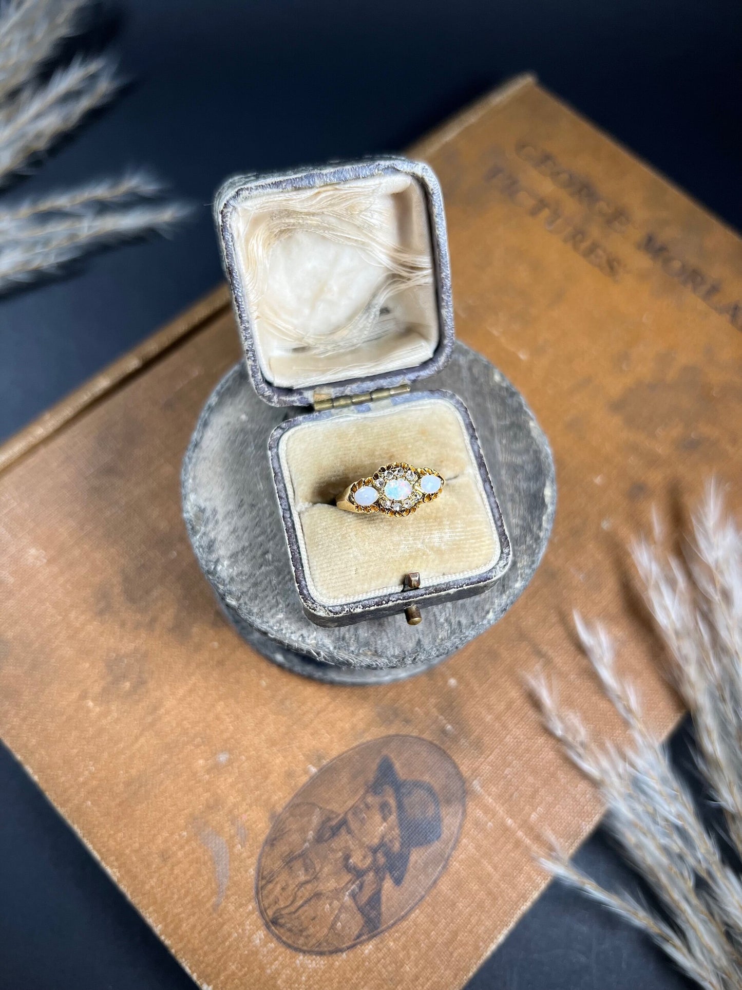 A yellow gold opal and diamond dress ring, in a ring box