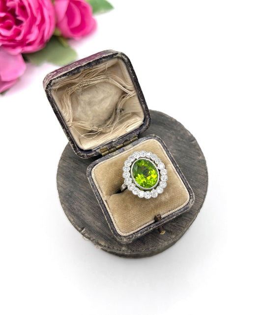 Antique French Platinum Peridot and Diamond Halo Cluster Ring, Circa 1910