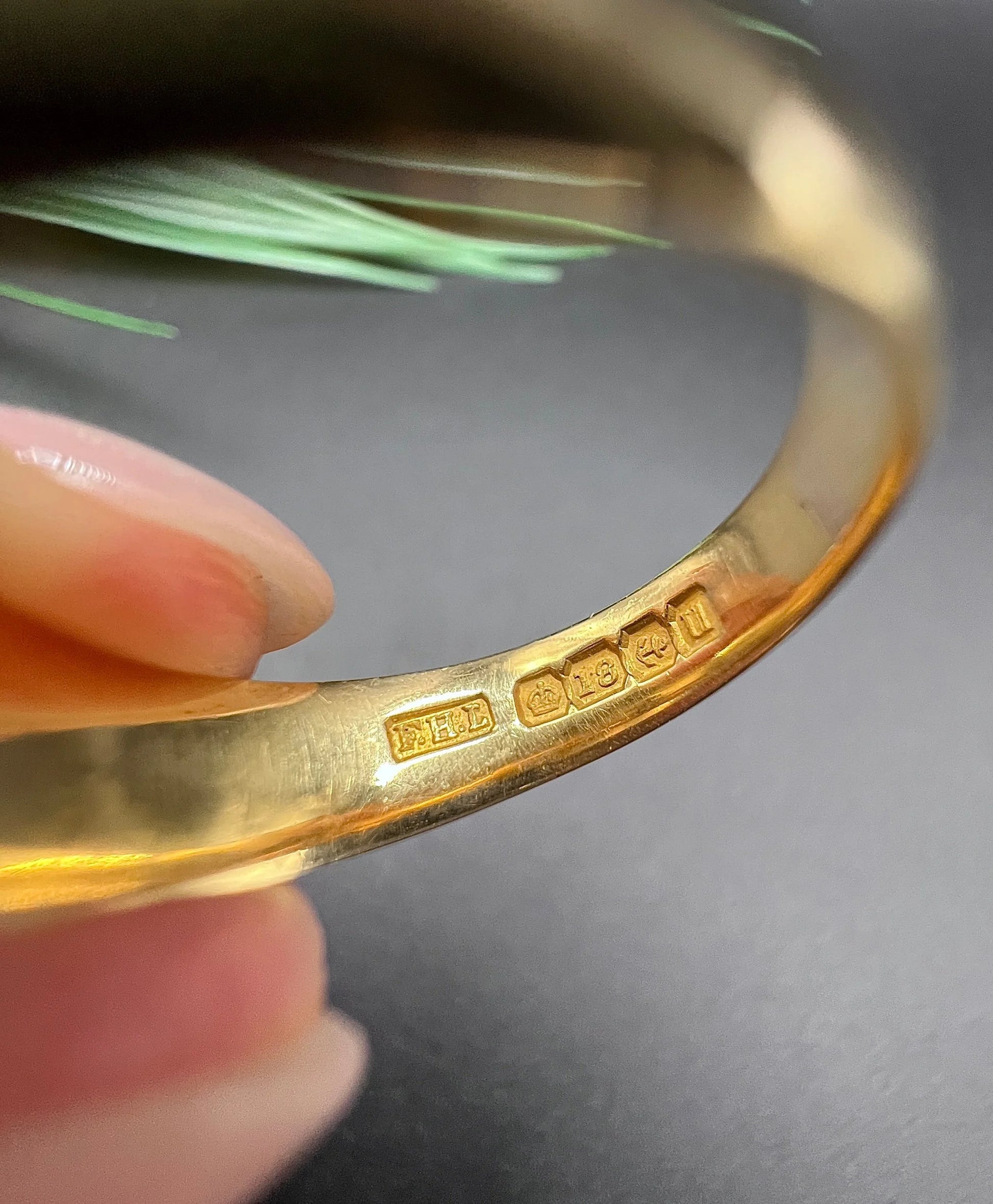 An 18 carat Birmingham 1919 hallmark inside a yellow gold ring shank
