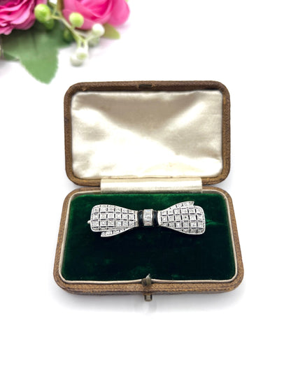 Art Deco 14 Carat White Gold Onyx and Diamond Bow Brooch, Circa 1920