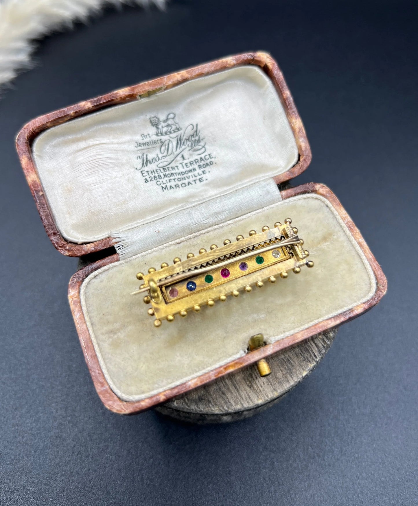 A yellow gold multi-gemstone and diamond acrostic brooch, in an antique box