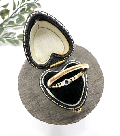 A diamond engagement style ring in yellow gold and platinum, in a ring box