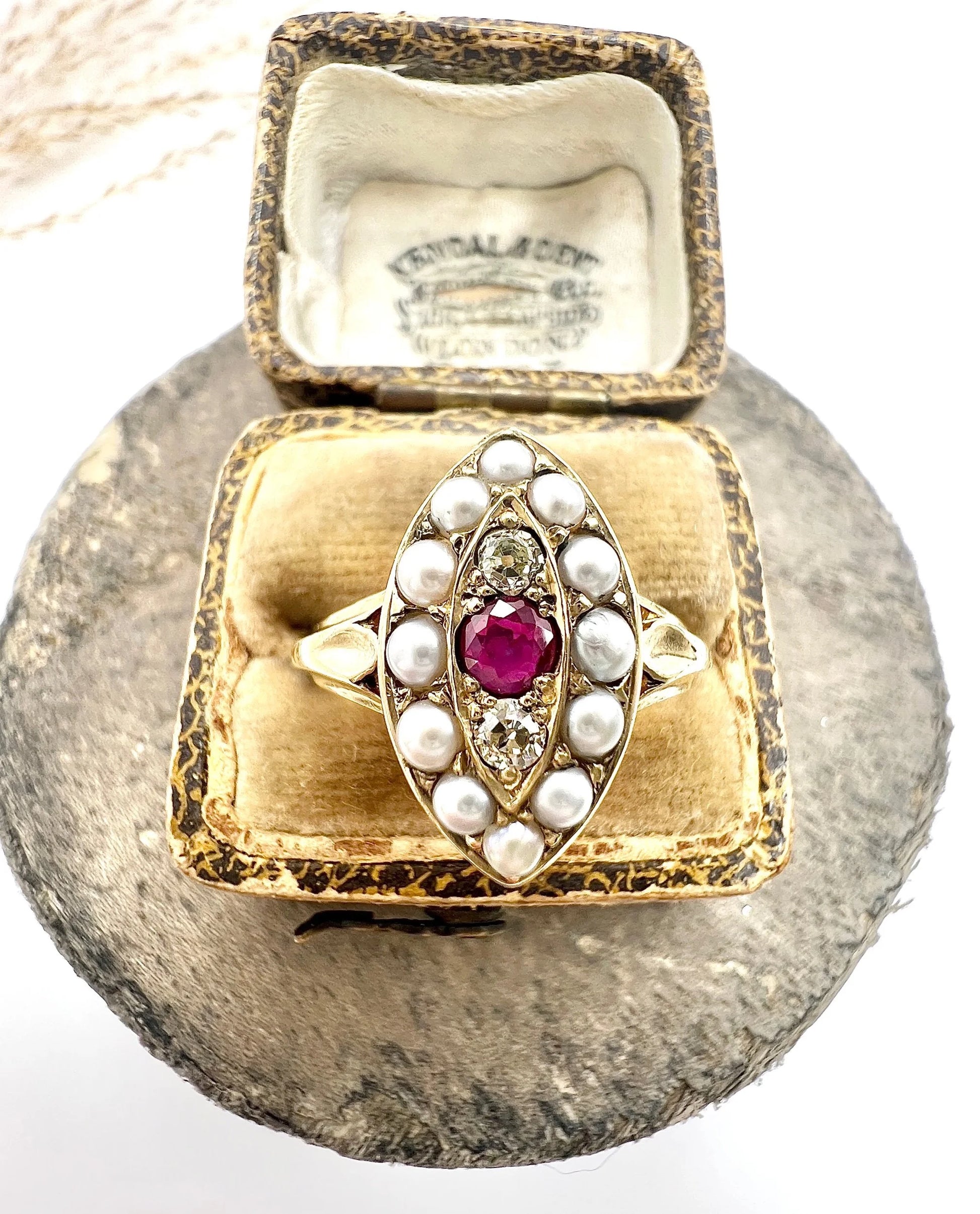 A navette shaped pearl, diamond and ruby cluster ring in yellow gold, in a ring box