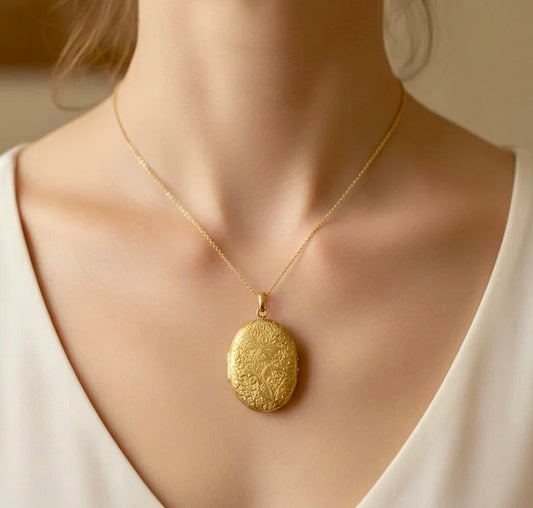 Victorian 18 Carat Yellow Gold Floral Engraved Oval Shaped Locket, Circa 1880