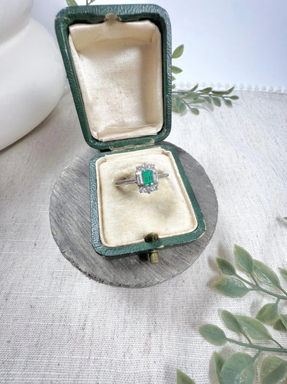 Vintage 18 Carat White Gold Emerald Cut Emerald and Diamond Cluster Ring, Circa 1940