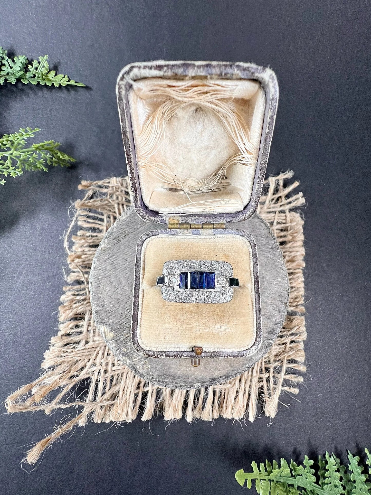 A sapphire and diamond cocktail ring in platinum, in an antique ring box