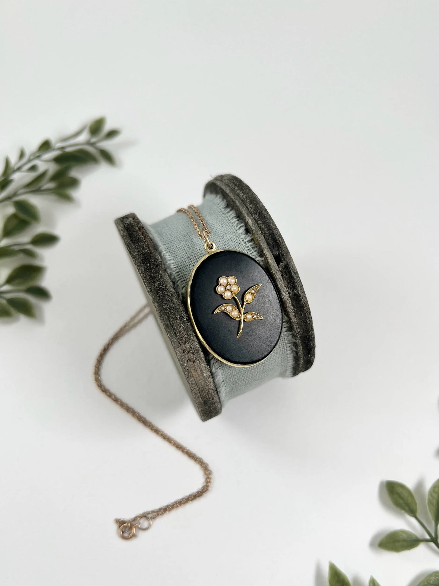 Edwardian 18 Carat Yellow Gold Onyx and Seed Pearl Flower Locket, Circa 1900