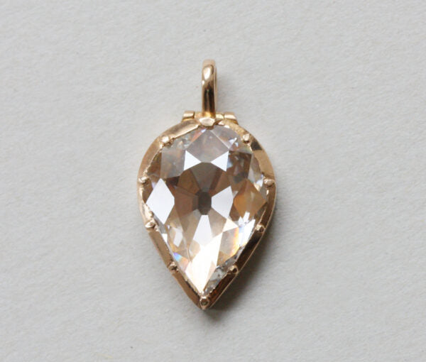 Bell and Bird Old Cut Pear Shaped Diamond Set 18ct Gold Locket; 18ct yellow gold locket pendant set with a large 3.13 carat flat old-cut pear-shaped diamond
