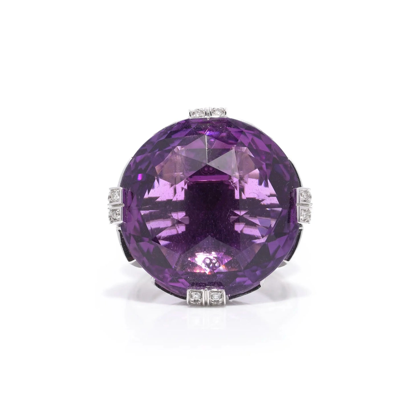 A round amethyst and diamond cocktail ring in white gold