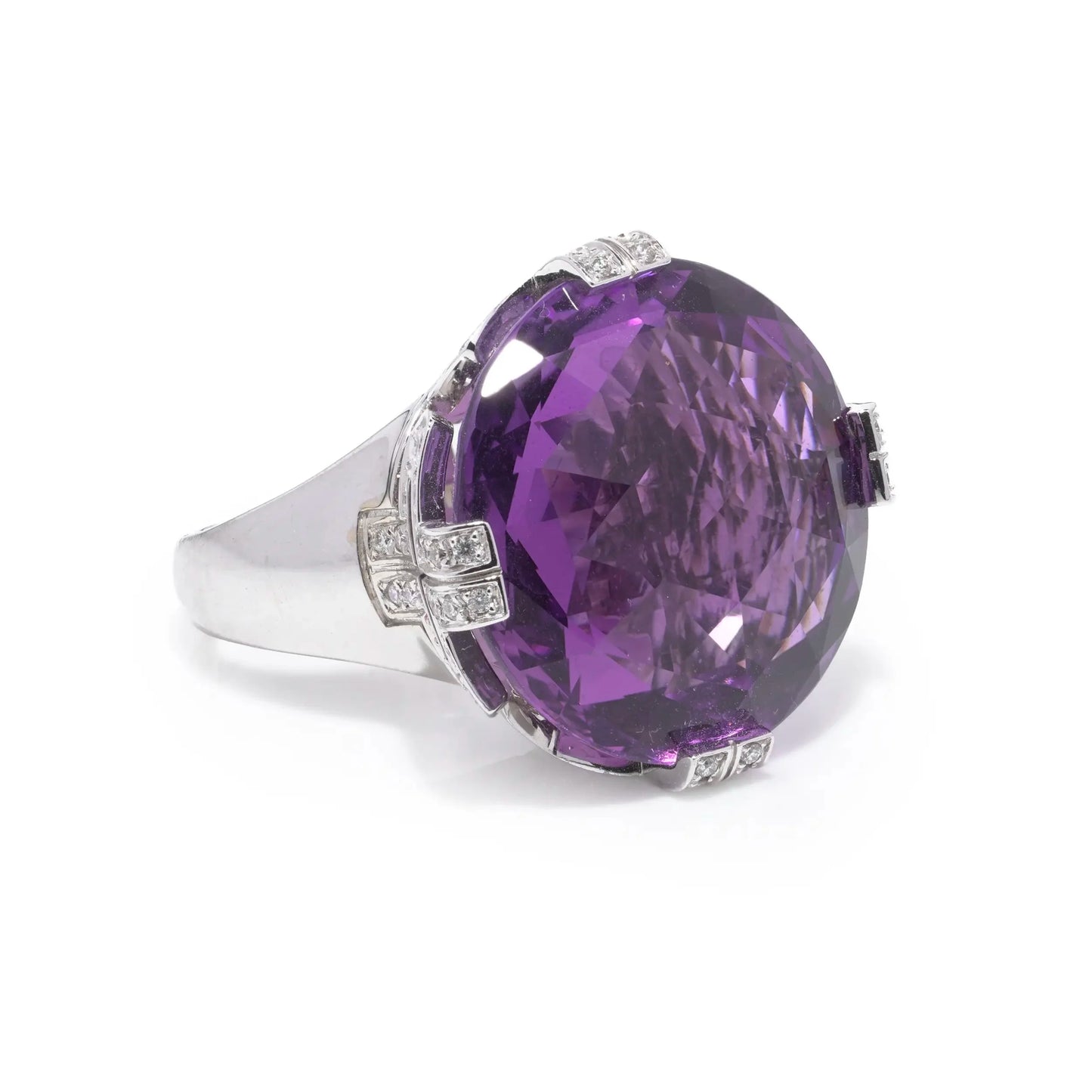 A round amethyst and diamond cocktail ring in white gold