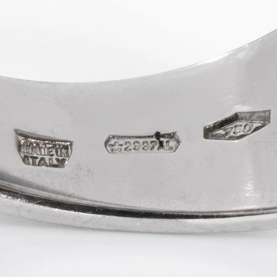 Close-up of an Italian town stamp, 750, and MADE IN ITALY stamps inside a white gold ring shank