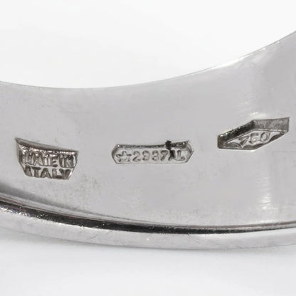 Close-up of an Italian town stamp, 750, and MADE IN ITALY stamps inside a white gold ring shank