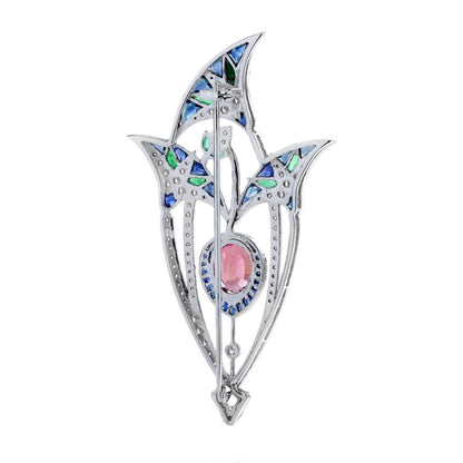 3.35ct Pink Tourmaline Sapphire Emerald and Diamond Brooch depicting a central pink lotus flower bud under its leaves in 18ct white gold