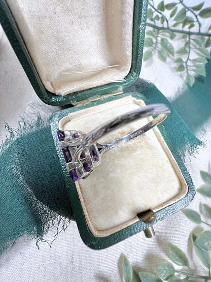 A solitaire amethyst cocktail ring in platinum