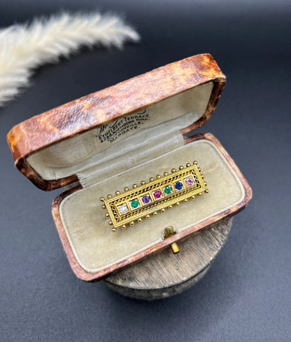 A yellow gold multi-gemstone and diamond acrostic brooch, in an antique box