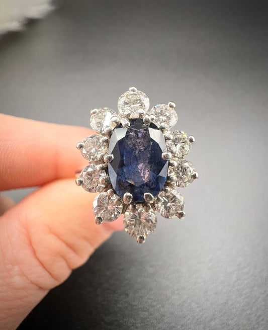 Sapphire and diamond cluster ring in white gold.