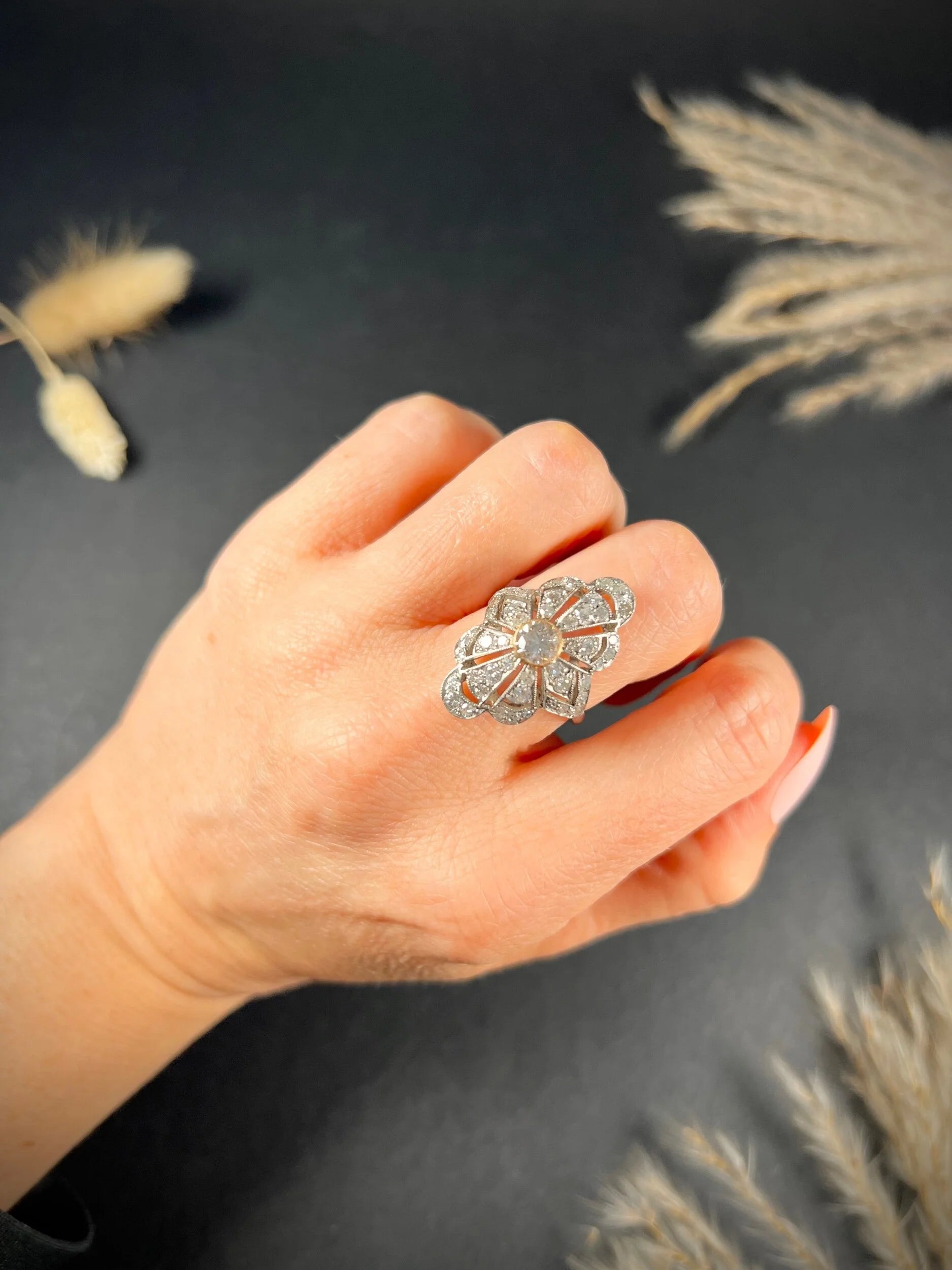 A diamond cocktail ring in white metal, modelled on a hand