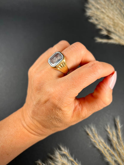 A yellow gold blue glass intaglio signet ring, modelled on a hand