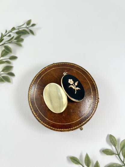 Edwardian 18 Carat Yellow Gold Onyx and Seed Pearl Flower Locket, Circa 1900