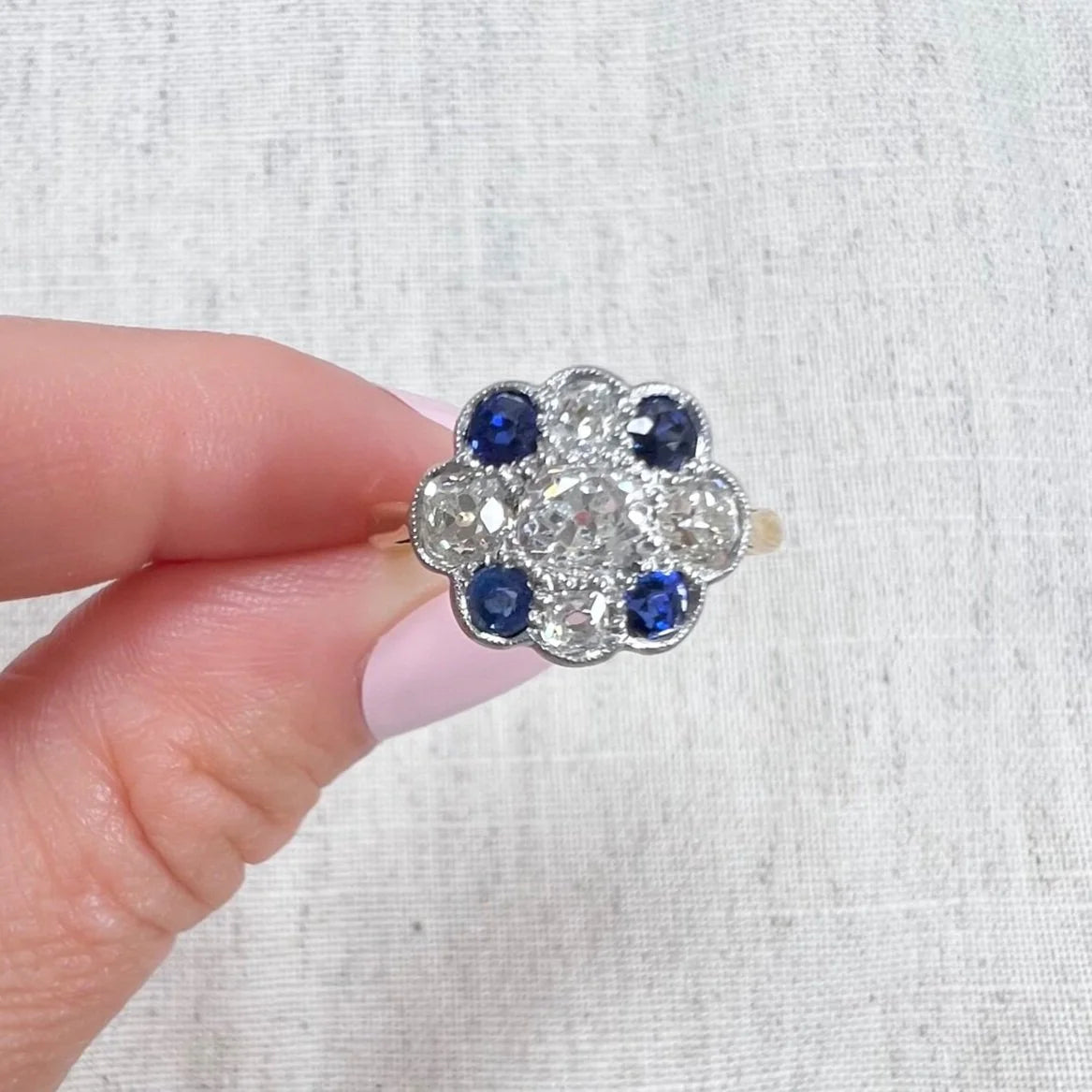 Edwardian 18 Carat Gold, Platinum, Sapphire and Diamond Daisy Cluster Ring, Circa 1910