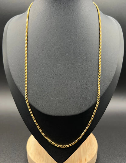 A fine curb link chain necklace in yellow gold