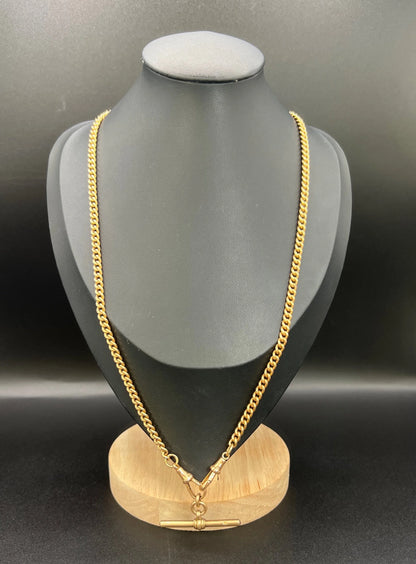 A gold curb link Albert chain, modelled on a black jewellery bust