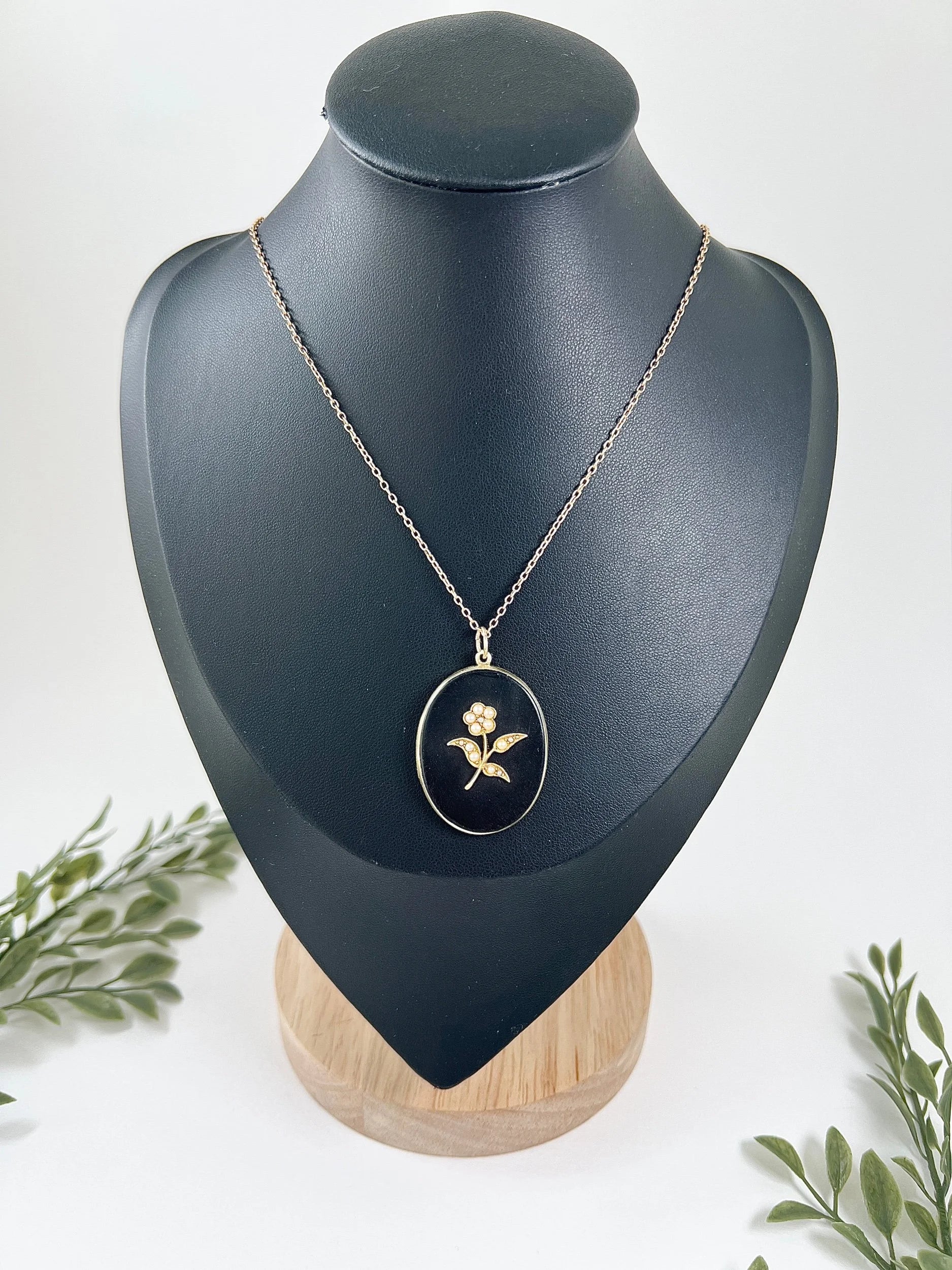 Edwardian 18 Carat Yellow Gold Onyx and Seed Pearl Flower Locket, Circa 1900
