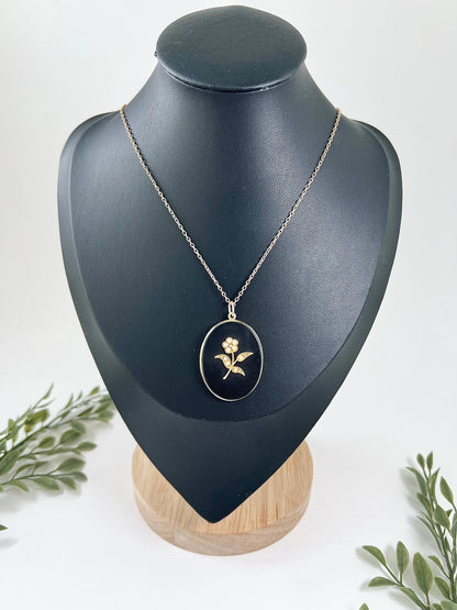 Edwardian 18 Carat Yellow Gold Onyx and Seed Pearl Flower Locket, Circa 1900