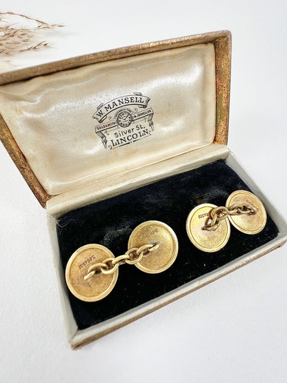 A pair of circular platinum and yellow gold cufflinks, in an antique box