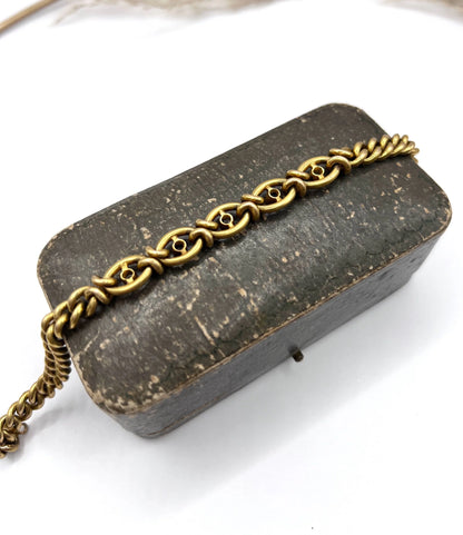 A sapphire and diamond fancy curb link bracelet in yellow gold