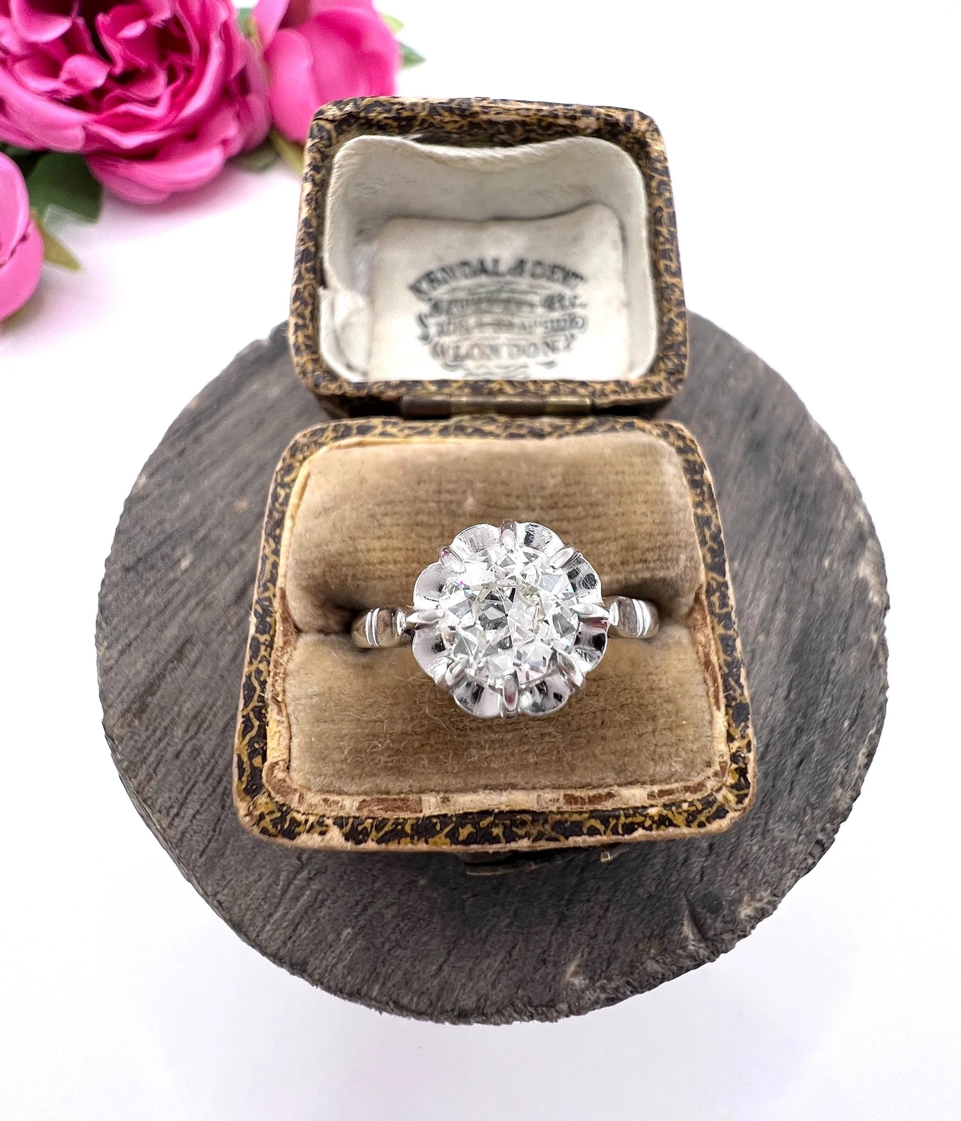 A solitaire diamond ring in platinum, in an antique ring box