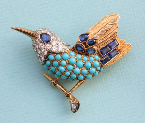 Cartier Vintage Turquoise, Diamond and Sapphire Bird Brooch; set with cabochon-cut turquoises and mixed-cut diamonds and sapphires, Signed and numbered