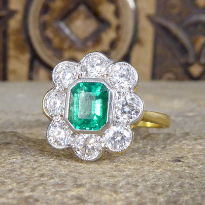 Contemporary 0.90ct Emerald and Diamond Cluster Ring