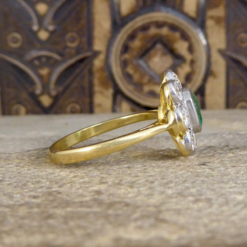Contemporary 0.90ct Emerald and Diamond Cluster Ring