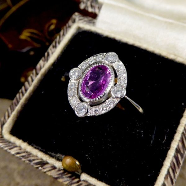Contemporary 1.05ct Pink Sapphire and Diamond Halo Ring