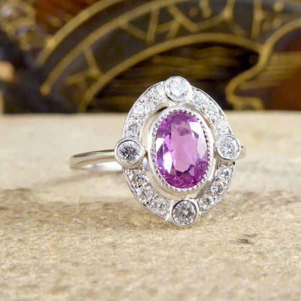 Contemporary 1.05ct Pink Sapphire and Diamond Halo Ring
