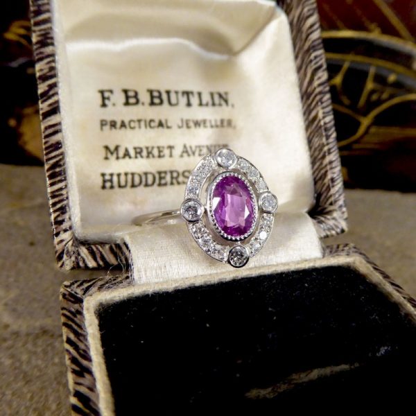 Contemporary 1.05ct Pink Sapphire and Diamond Halo Ring