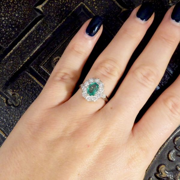 Contemporary 1ct Emerald and 0.95ct Diamond Cluster Ring