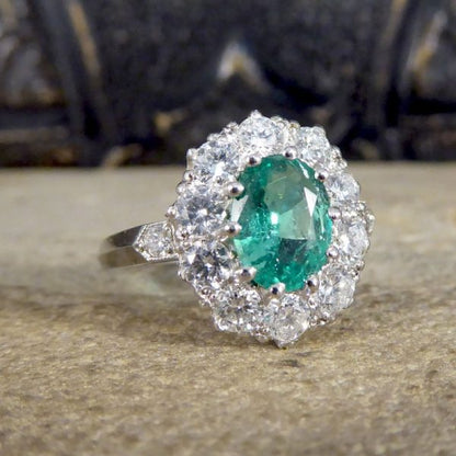 Contemporary 1ct Emerald and 0.95ct Diamond Cluster Ring
