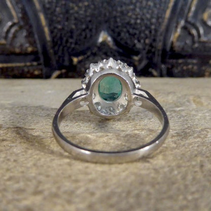 Contemporary 1ct Emerald and 0.95ct Diamond Cluster Ring