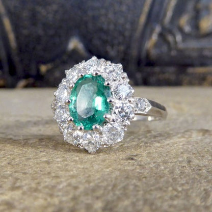 Contemporary 1ct Emerald and 0.95ct Diamond Cluster Ring