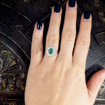Contemporary 1ct Emerald and 0.95ct Diamond Cluster Ring