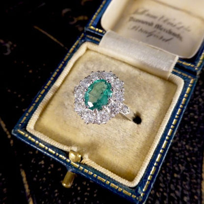 Contemporary 1ct Emerald and 0.95ct Diamond Cluster Ring