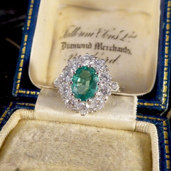 Contemporary 1ct Emerald and 0.95ct Diamond Cluster Ring